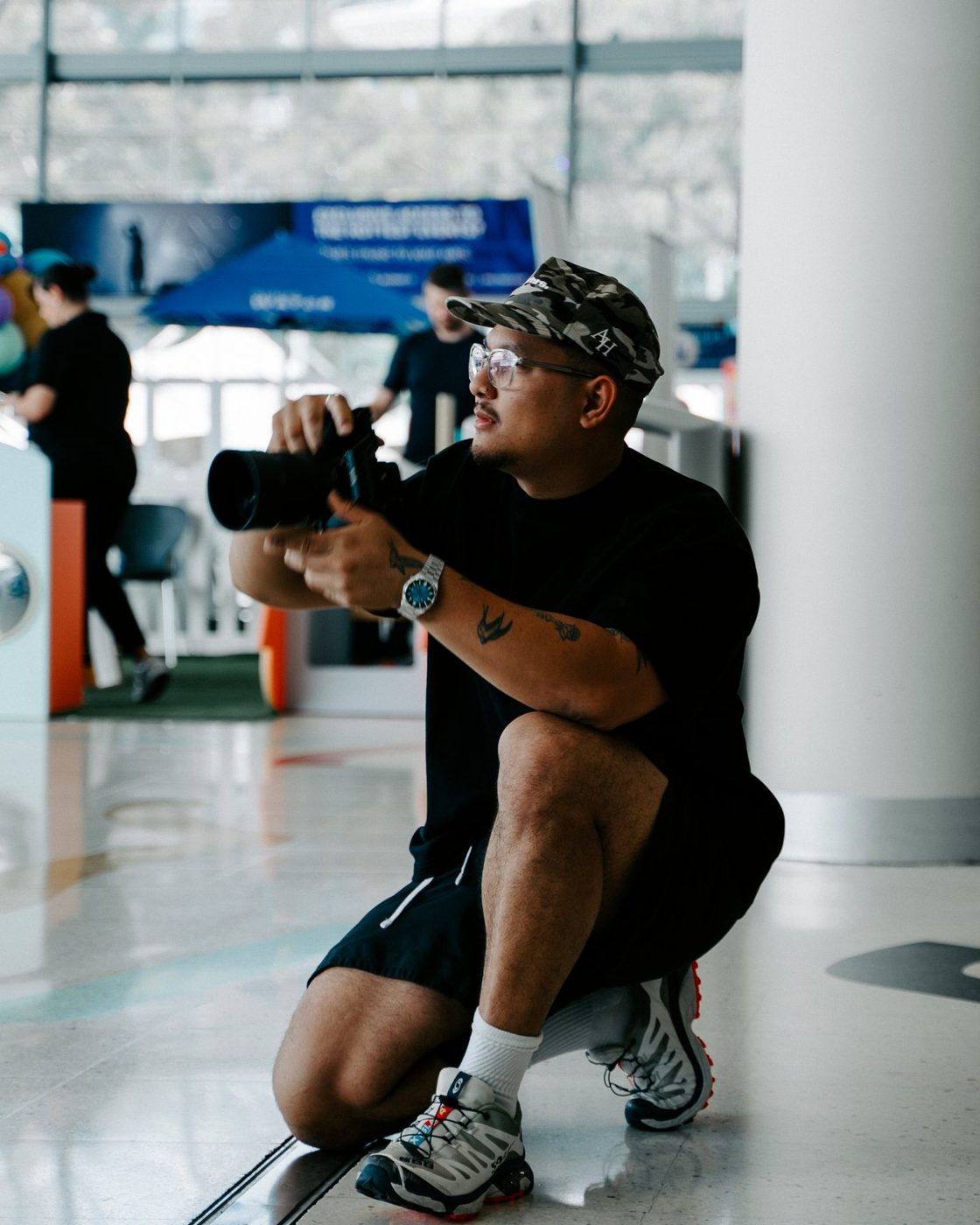 Laurence Thanadon Landayan on a shoot, camera in hand